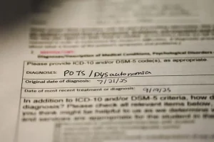 Detail of medical record showing POTS diagnosis. Photo by Annabel Dewey | The Breeze